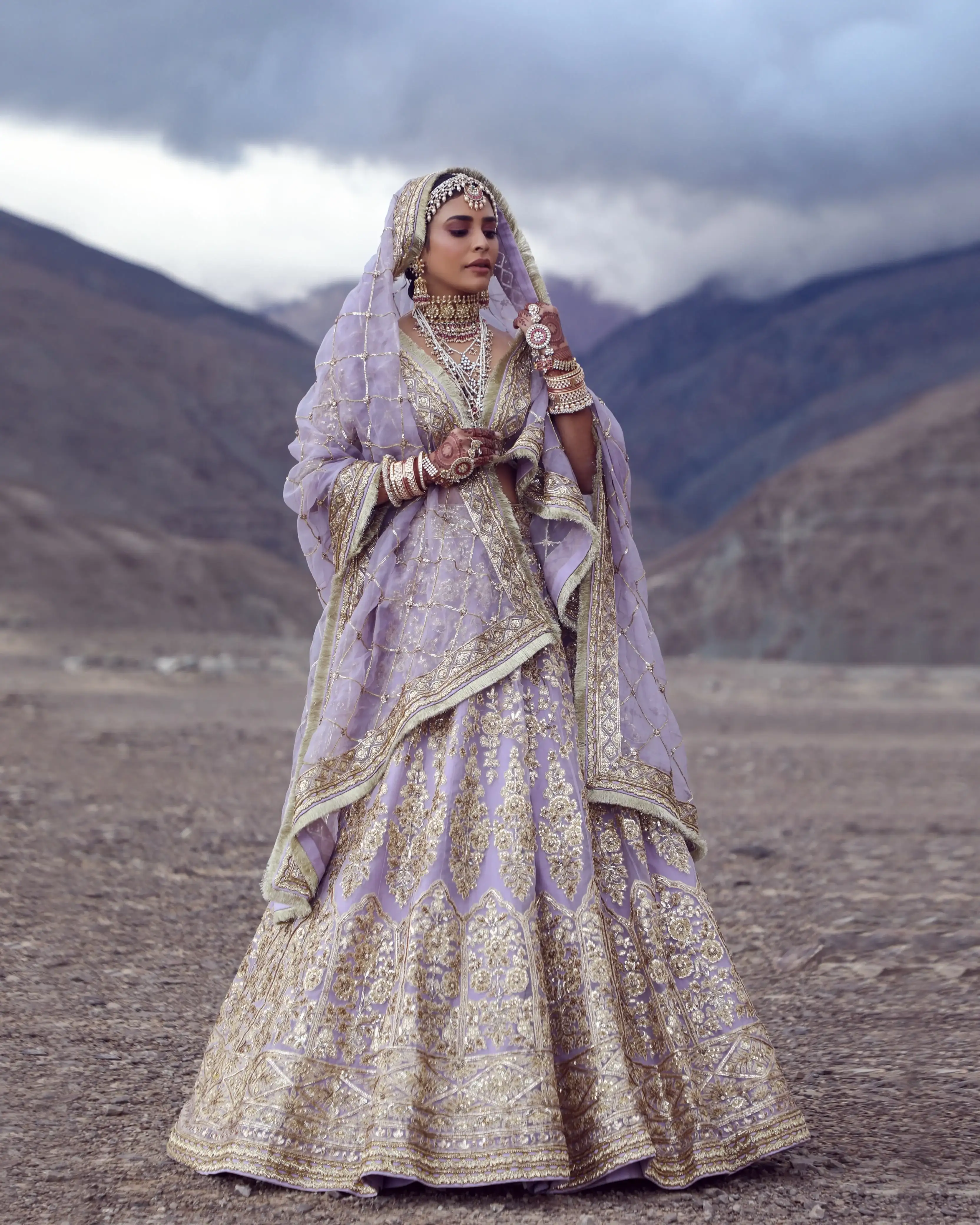 Bride under storm clouds in the high-altitude desert