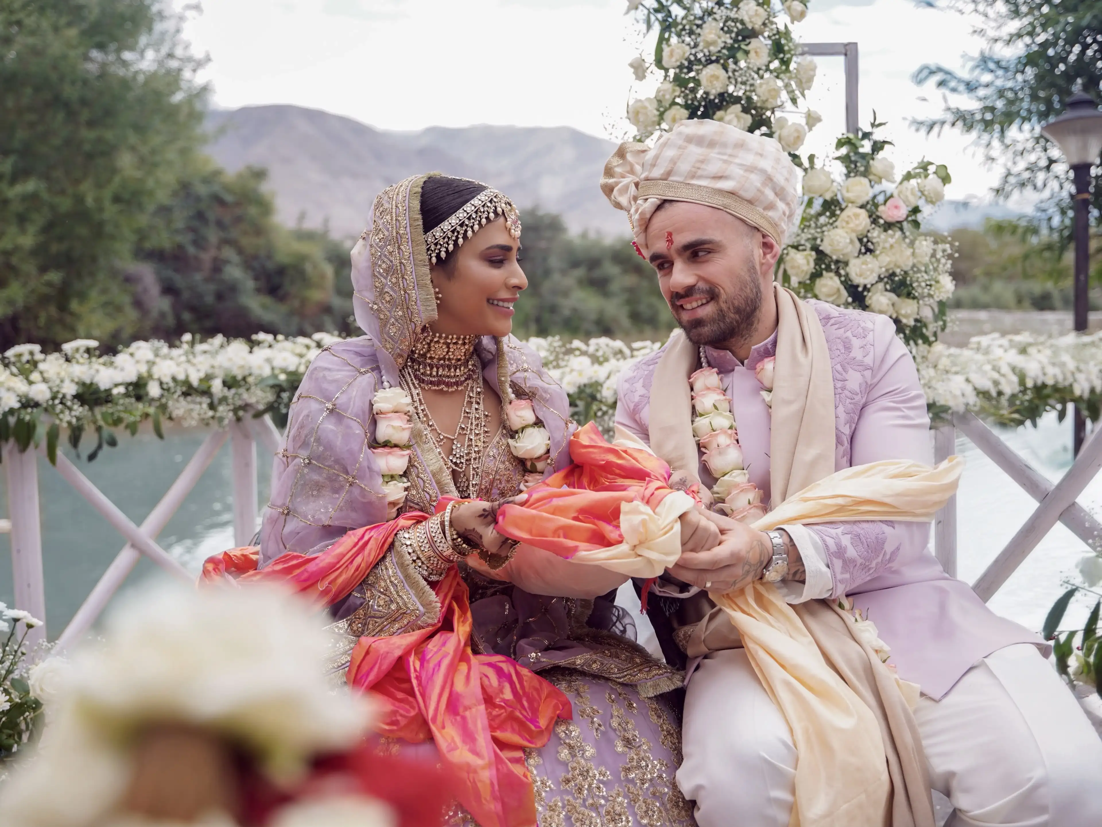 Bride and groom sharing a smile during the wedding rituals